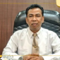 POTRET: Kepala DPMD Sumenep, Anwar Syahroni Yusuf, di ruang kerjanya. (Dok. Istimewa)